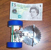 Comparing an Ant Weight Robot to the size of a 5 note.